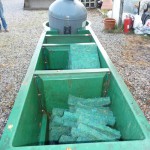 Multibay and bead being removed from koi pond