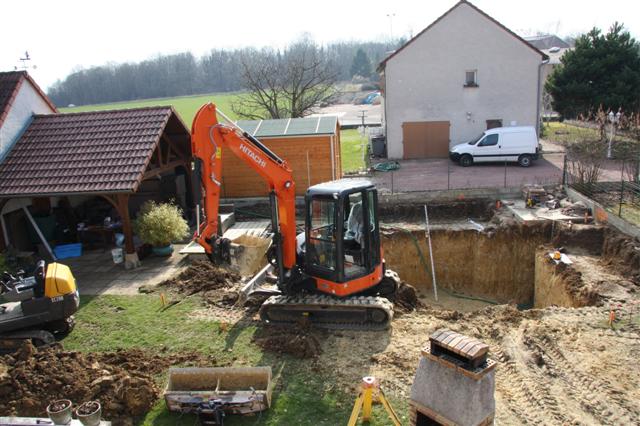 Digger removing soil