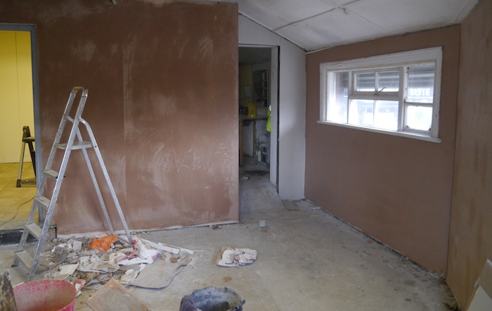 Plastering the walls ready for ERIC Mat cartridges to be made