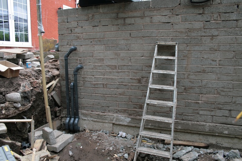 Koi pond pipework into wall