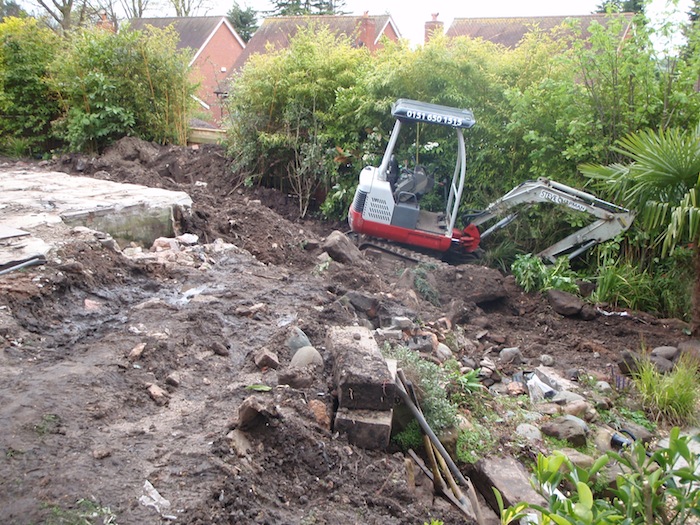 Removing more soil for koi pond