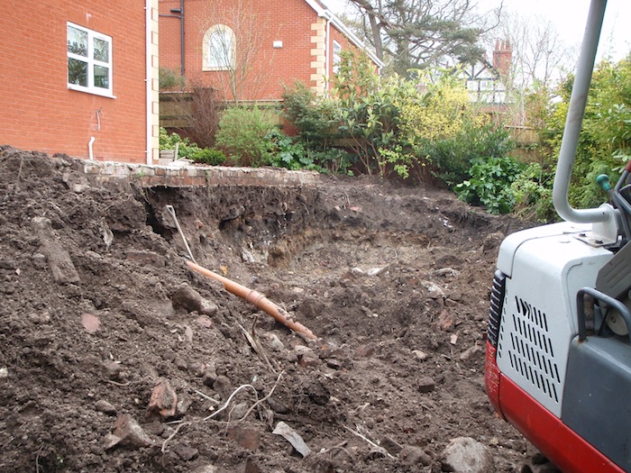 Moving the main drainage pipe for koi pond