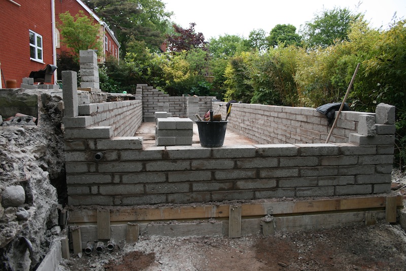 Blockwork being built for koi pond walls