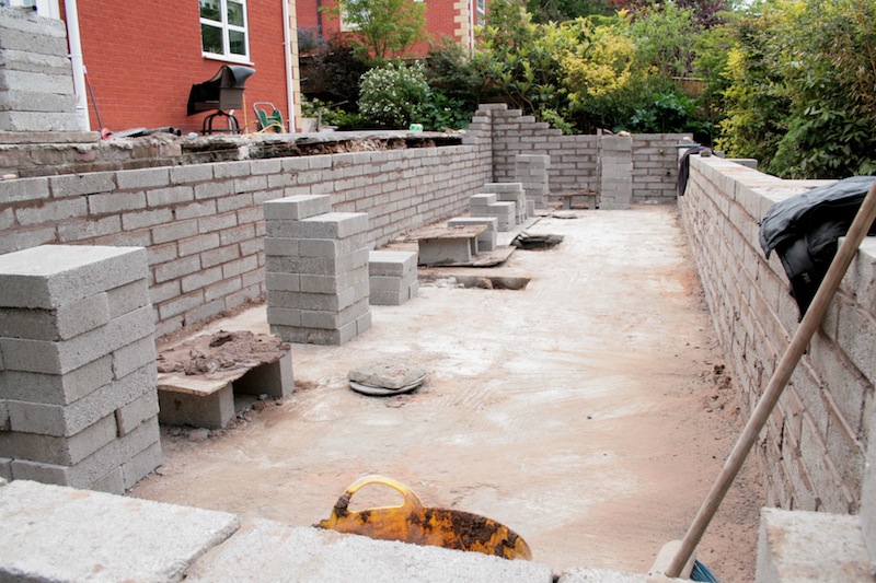 Blockwork being built for koi pond walls