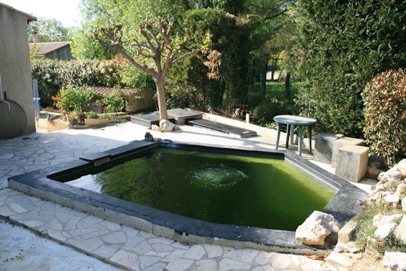 4,500-gallon Koi pond system is waiting for some final landscaping